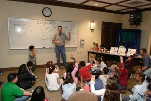 teacher teaching magnets in a classroom