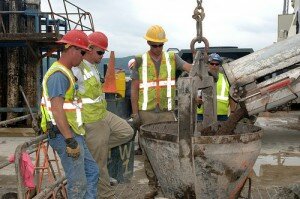 pouring concrete in high-viz jackets