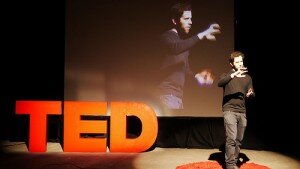 ted talk speaker with a blurry background