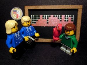 lego minifigs hanging out in front of a chalkboard